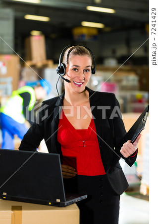dispatcher using headset at warehouse of forwarding 7241429