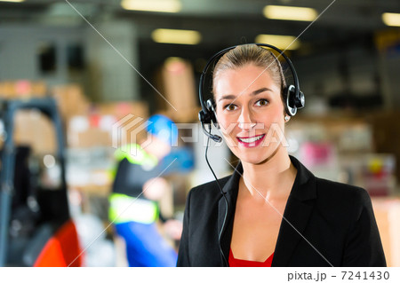 dispatcher using headset at warehouse of forwarding 7241430
