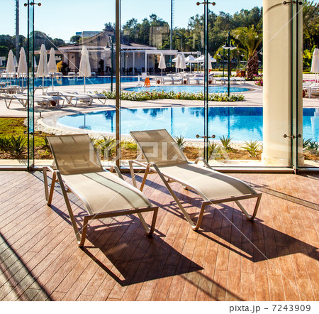 Sunbeds in the indoor swimming pool 7243909