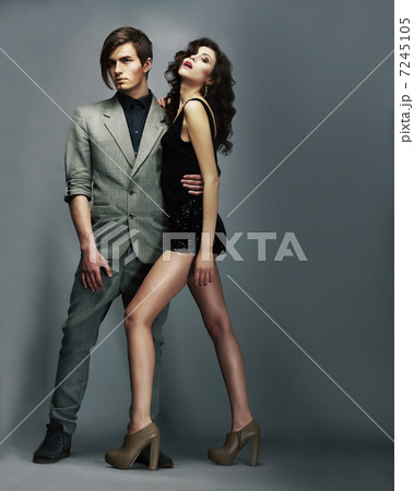Stylish Man and Luxurious Woman. Luxurious Fashion Couple Flirting 7245105