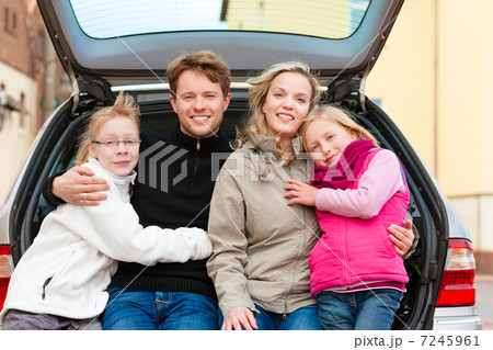 Family on a car trip sitting in the back 7245961