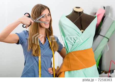 Fashion designer or tailor working in studio 7258363