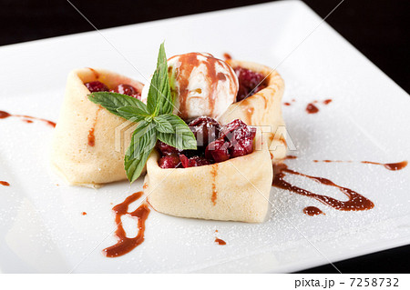 Rolled pancakes with cherry  7258732
