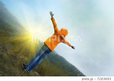 Young woman standing with raised hands Young woman standing with raised hands 7263693