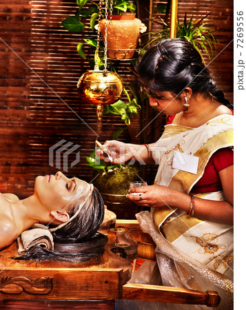 Woman having mask at ayurveda spa. Woman having mask at ayurveda spa. 7269556