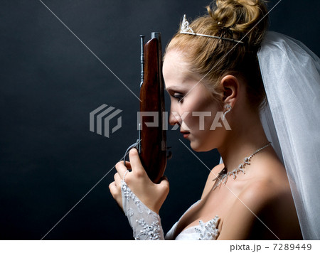bride holding old gun 7289449