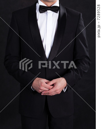 Stylish man in elegant black tuxedo 7289528