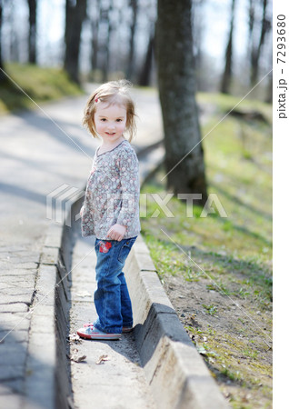 Adorable toddler girl having a walk 7293680
