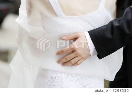 Bride girdling grooms waist Bride girdling grooms waist 7298530