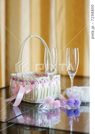 A pair of wedding glasses, basket and a ring pillow 7298800