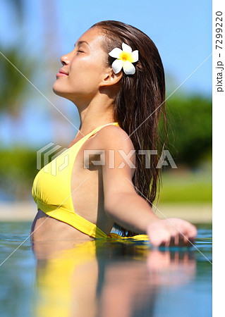 Spa woman enjoying meditating in water 7299220