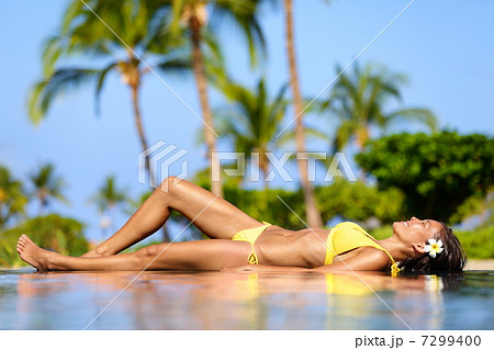 Beautiful vacation woman relaxing at a spa resort 7299400
