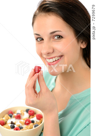 Happy woman with a bowl of cereal 7299679