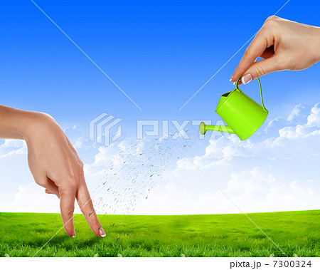 Hand with a small watering Hand with a small watering 7300324