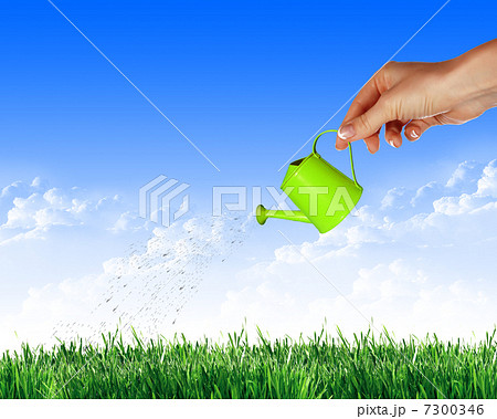 Hand with a small watering Hand with a small watering 7300346