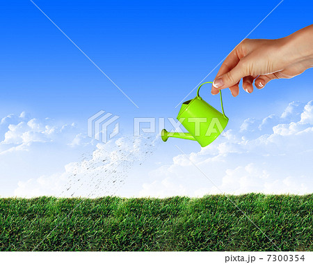 Hand with a small watering Hand with a small watering 7300354