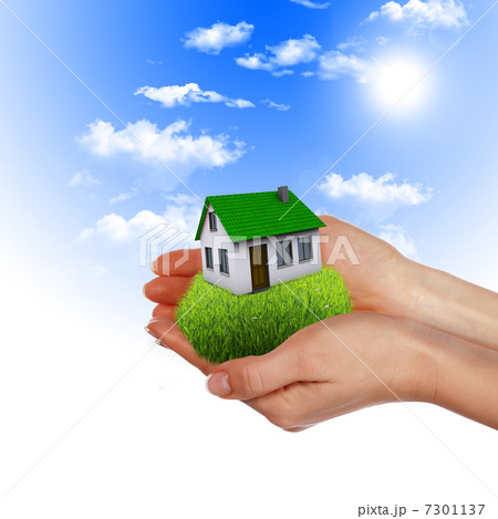 House in the hands against the blue sky 7301137