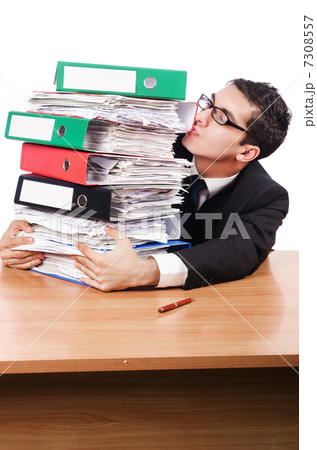 Young busy businessman at his desk 7308557