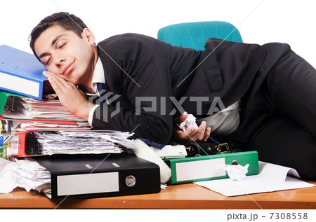 Young busy businessman at his desk 7308558
