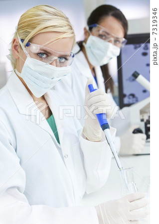 Female Research Scientist With Pipette & Flask In Laboratory Female Research Scientist With Pipette & Flask In Laboratory 7319346
