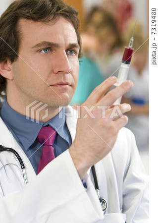 Young Doctor With Syringe 7319480