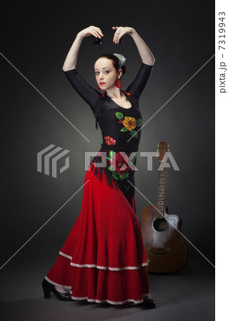 young woman dancing flamenco with castanets on black young woman dancing flamenco with castanets on black 7319943