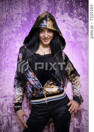 Young attractive woman against pink grunge wall 7320164