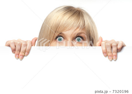 surprised young woman holding white empty paper isolated on whit surprised young woman holding white empty paper isolated on whit 7320196