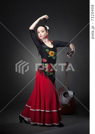 young woman dancing flamenco with castanets on black young woman dancing flamenco with castanets on black 7320408