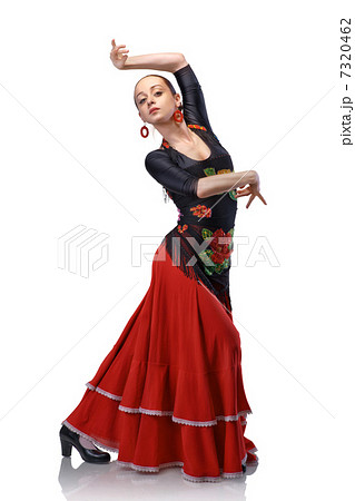 young woman dancing flamenco with castanetsの写真素材 [7320462