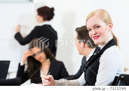 Business - businesspeople, meeting and presentation in office 7323299