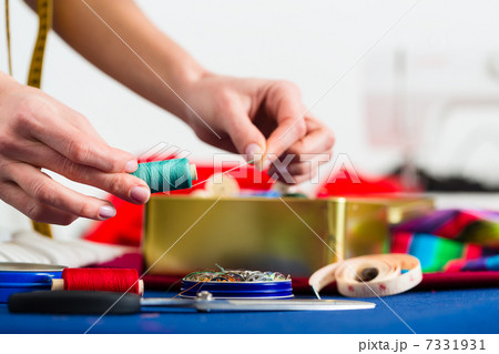 Fashion designer or tailor working in studio 7331931