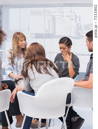 Patients and therapist listening to woman Patients and therapist listening to woman 7333802