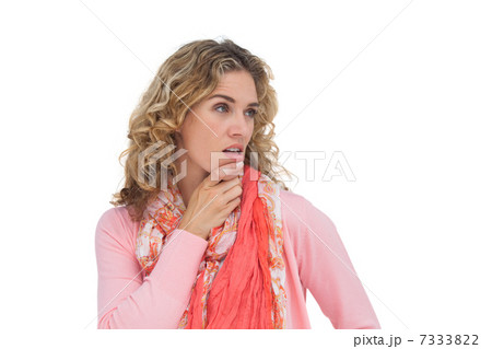 Blonde thoughtful woman posing while touching her chin 7333822