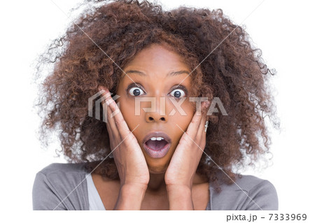 Amazed attractive woman gesturing 7333969