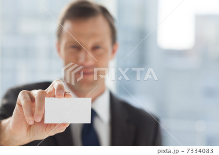 Businessman showing business card 7334083