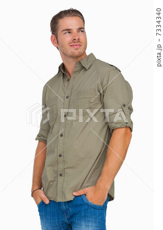 Man smiling and looking away 7334340