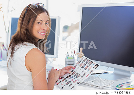 Editor looking over shoulder at camera 7334468