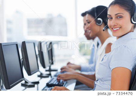 Smiling call center employee looking at camera 7334470