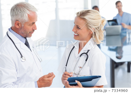 Two doctors speaking to each other Two doctors speaking to each other 7334960