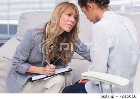 Therapist helping her patient 7335016
