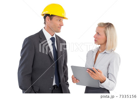 Two serious architects looking at each other 7335156