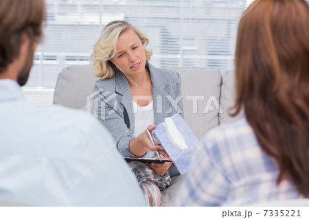 Therapist giving tissue to a woman 7335221