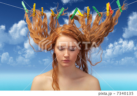 girl drying red hairs 7340135