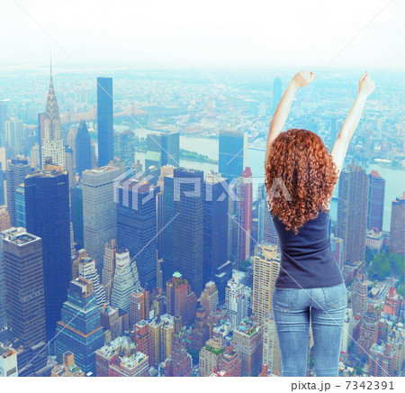 Back view young woman in jeans hands up. Rear view 7342391