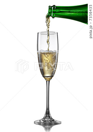 Champagne pouring into glass isolated on white Champagne pouring into glass isolated on white 7356435