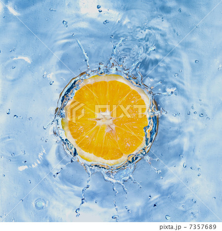Fresh lemon dropped into water with bubbles isolated on white Fresh lemon dropped into water with bubbles isolated on white 7357689