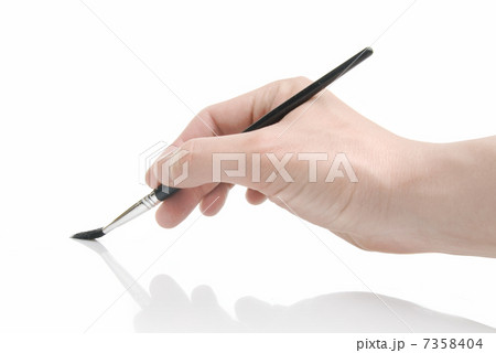 Hand holding brush isolated on white Hand holding brush isolated on white 7358404
