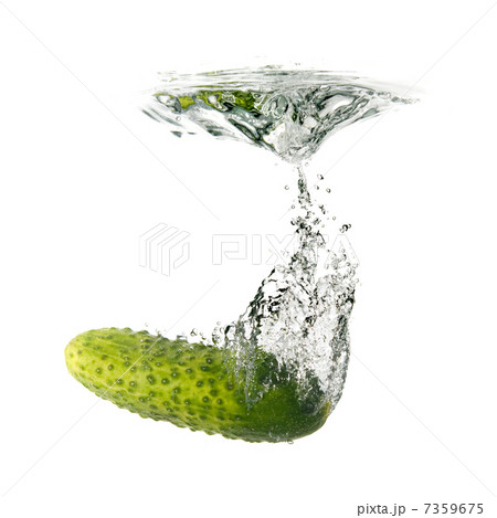 green cucumber dropped into water isolated on white 7359675