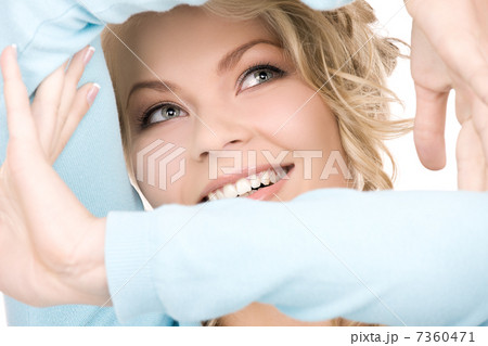 lovely blonde creating a frame with hands lovely blonde creating a frame with hands 7360471